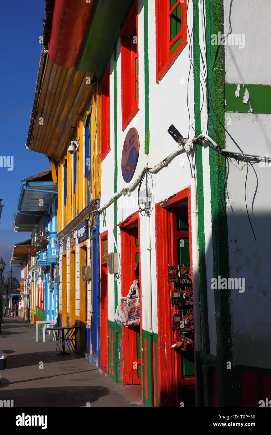 Brightly painted shops, bars and restaurants in the town of Salento in Quindío district of Colombia.Paisa style architecture and built of adobe brick. Stock Photo