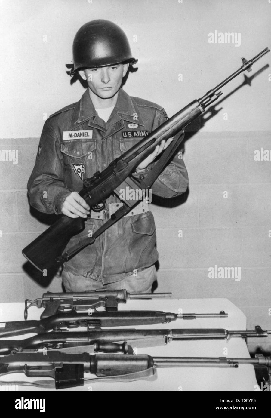 military, USA, army, weapons, soldier with the new M14 rifle, 28.4.1960, automatic rifle, M-14, M 14, sub-machine gun M3 Grease Gun, M-3, M 3, M1 Garand, M-1, M 1, M1918 Browning Automatic Rifle, BAR, M-1918, M 1918, armament, firearm, fire arm, firearms, fire arms, steel helmet, steel helmets, adoption, innovation, innovations, American armed forces, US Army, 1960s, 60s, 20th century, people, man, men, male, USA, United States of America, army, armies, weapons, arms, weapon, arm, soldier, soldiers, rifle, gun, rifles, guns, historic, historical, Additional-Rights-Clearance-Info-Not-Available Stock Photo