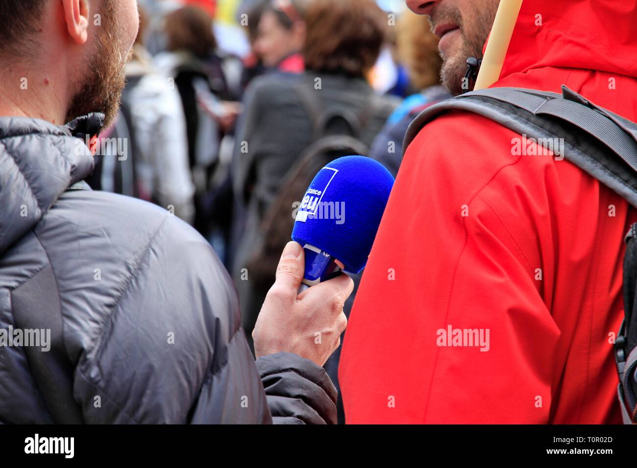 Illustration of media during a trade union demonstration, including radio  France Bleu Isere during an interview with a protester, and a cameraman  Stock Photo - Alamy