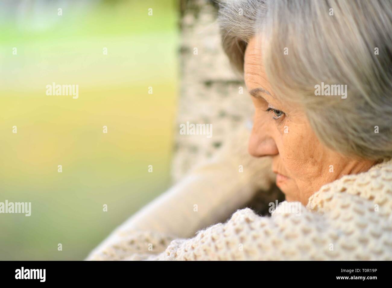 Sad woman standing outside hi-res stock photography and images - Alamy