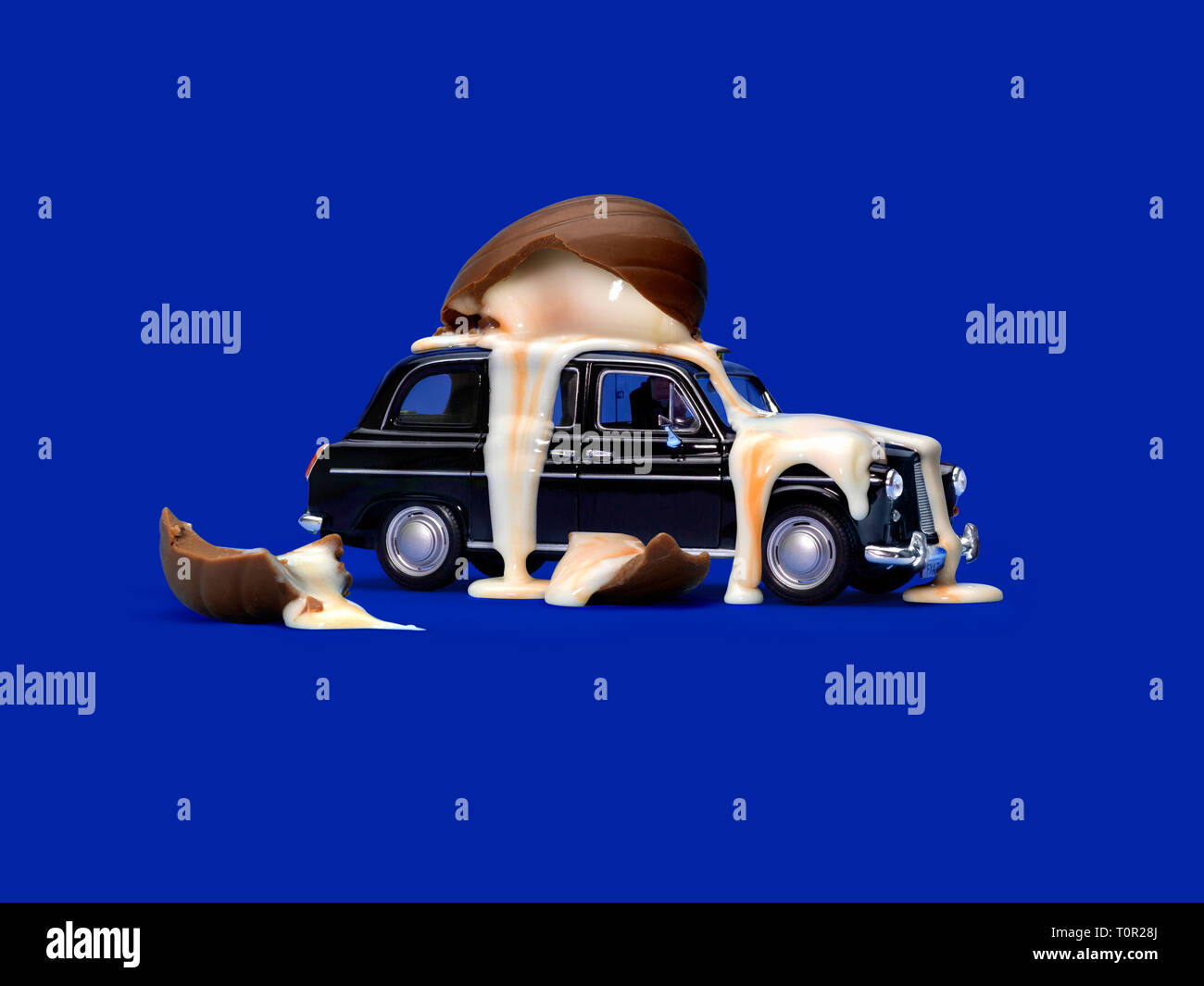 Taxi with broken chocolate egg on top Stock Photo