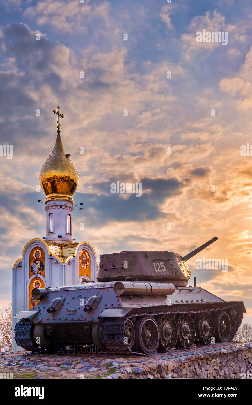 Tank momument and the orthodox church Sfantul Gheorghe in the Memorial of Glory in Suvorov Square in Tiraspol, Moldova Stock Photo