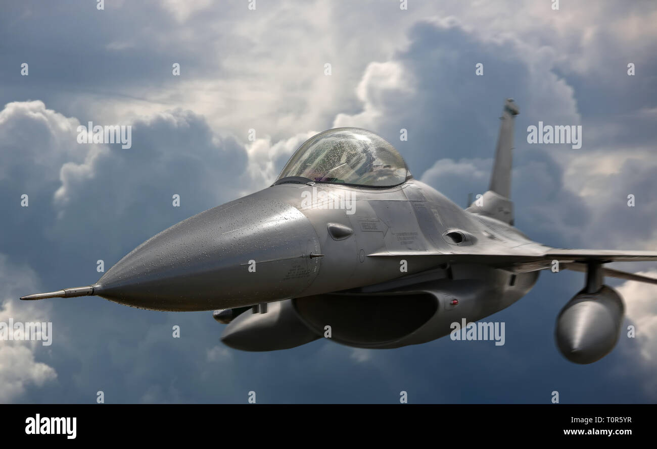 Flying jet aircraft an mission - frontal view Stock Photo