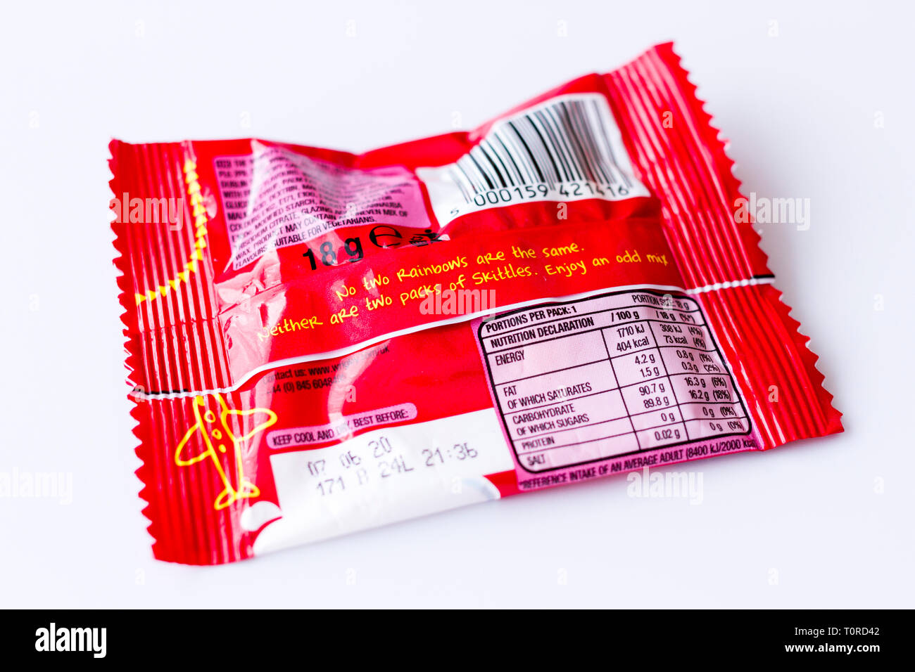 Nutrition declaration information on the back of a packet of Skittles sweets, candy. United Kingdom Stock Photo