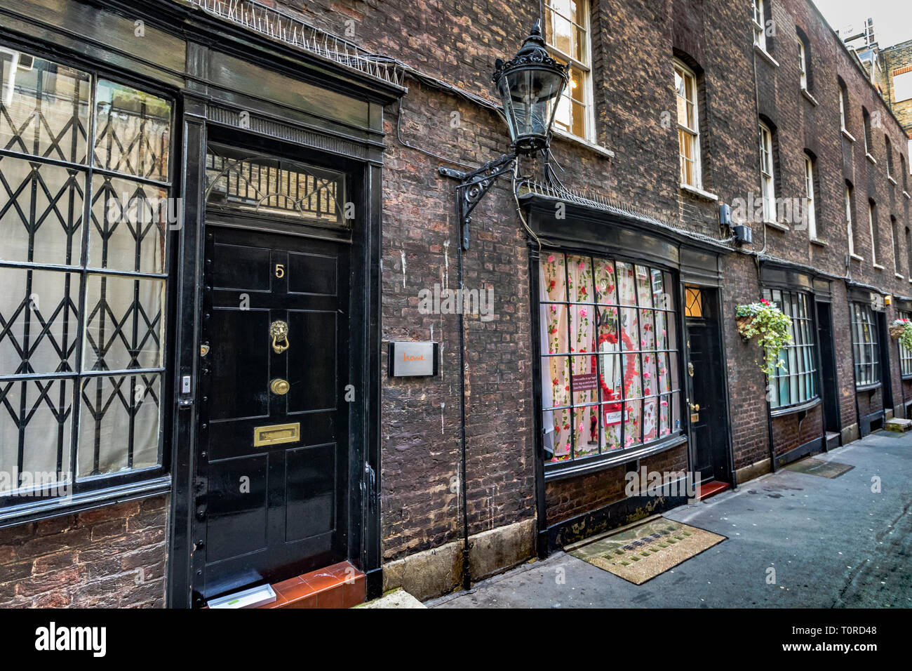 Bow fronted houses in Goodwin's Court, a narrow alley running between St. Martin’s Lane and Bedfordbury  in London's West End, London, UK Stock Photo