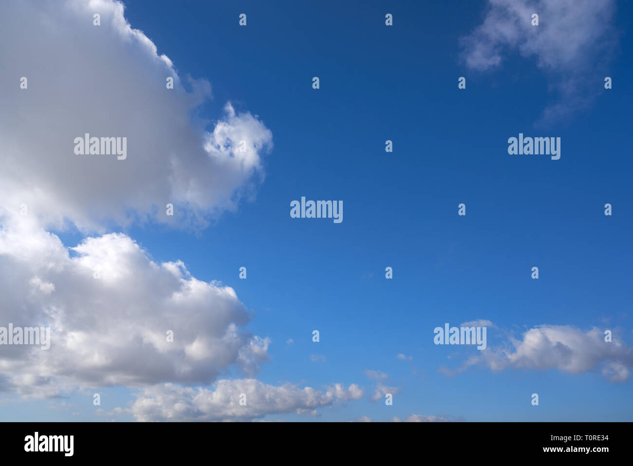 Blue summer sky with white clouds background Stock Photo - Alamy