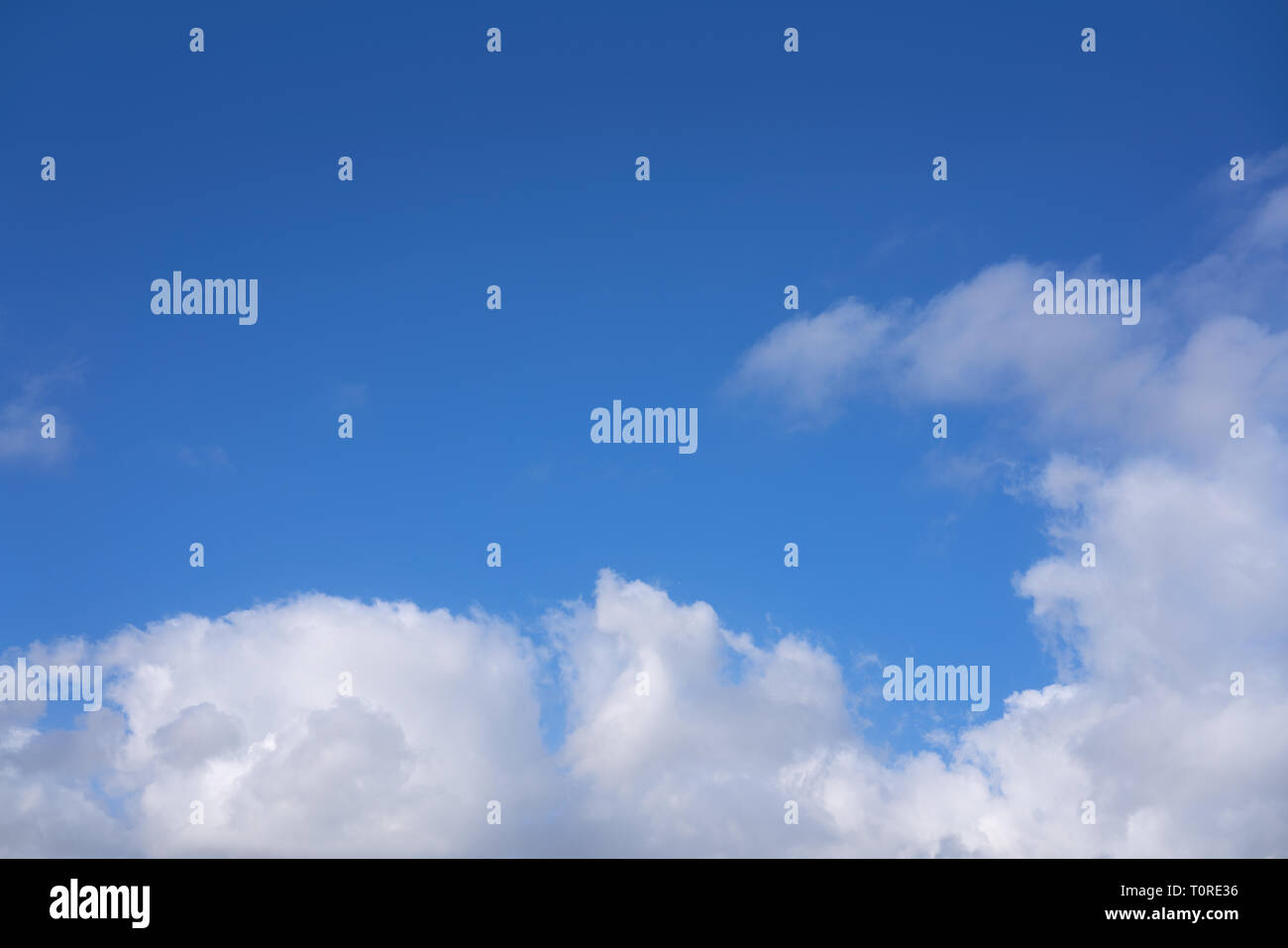 Blue summer sky with white clouds background Stock Photo - Alamy