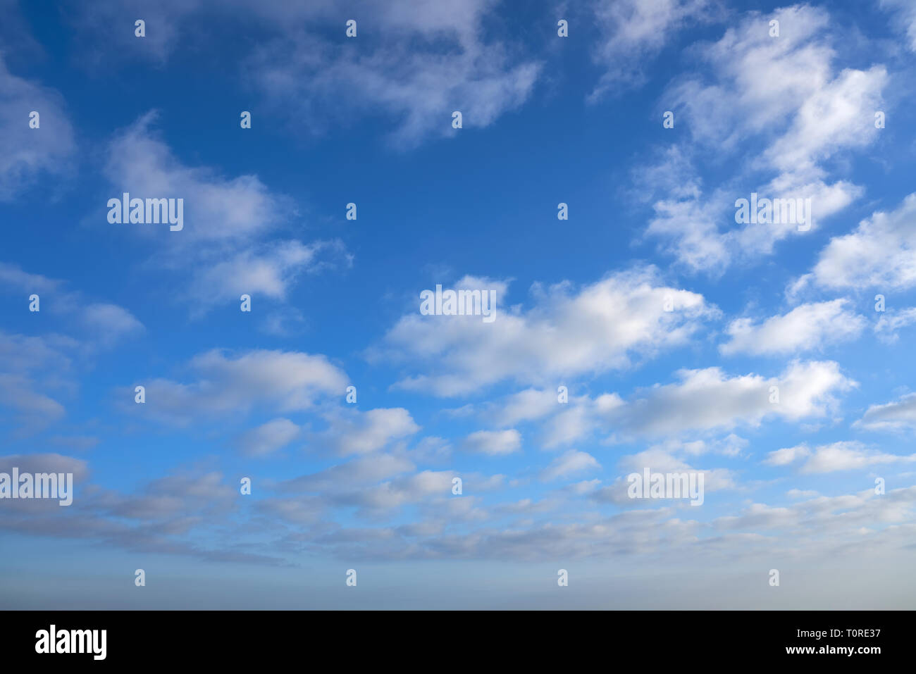 Blue summer sky with white clouds background Stock Photo - Alamy