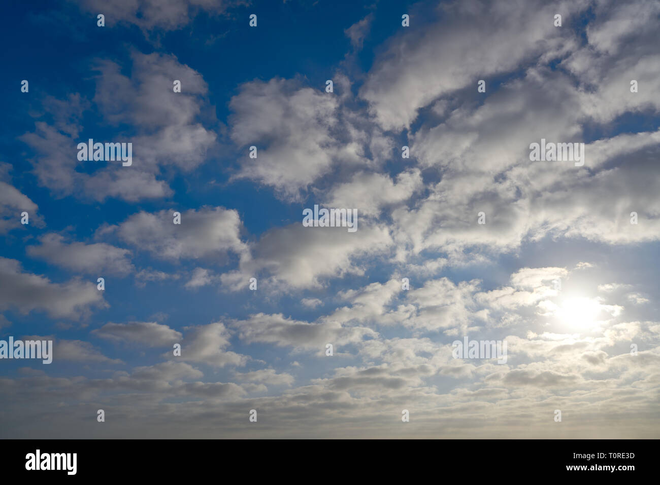 Blue summer sky with white clouds background Stock Photo - Alamy