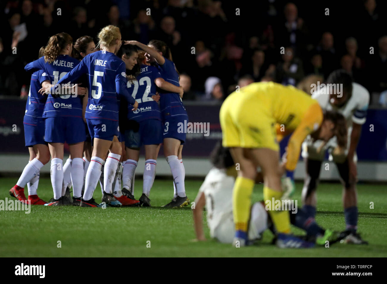 Chelsea Women celebrate after they make it 2-0 the UEFA Women's Champions League quarter final first leg match at the Cherry Red Records Stadium, London. Stock Photo