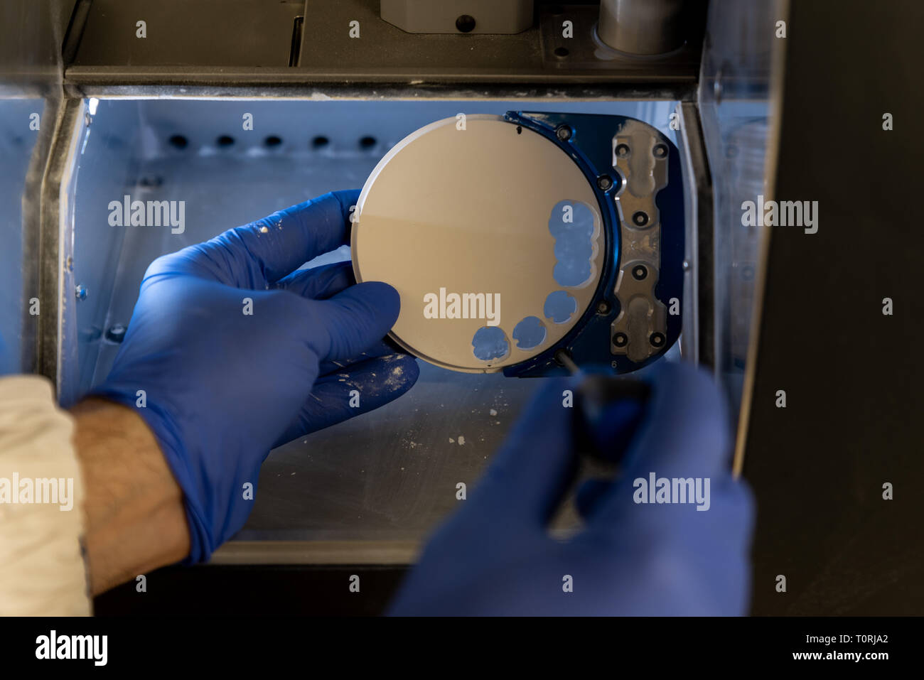 Dental milling machine carving out shape of human teeth Stock Photo