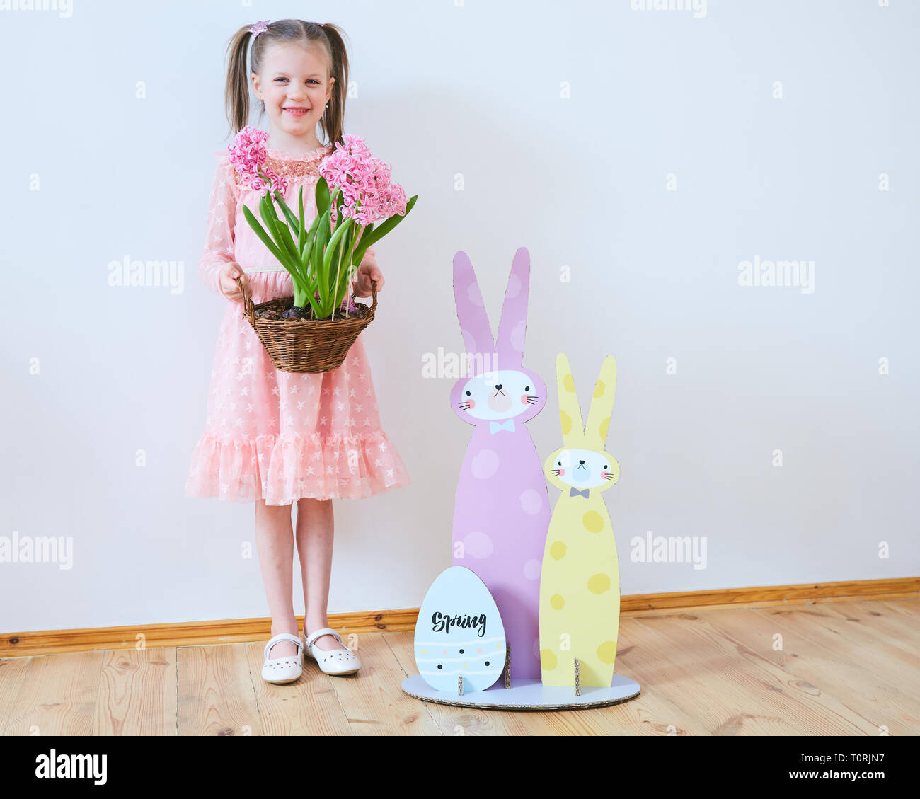Easter 2019 Beautiful little girl in a dress with Easter decorations ...