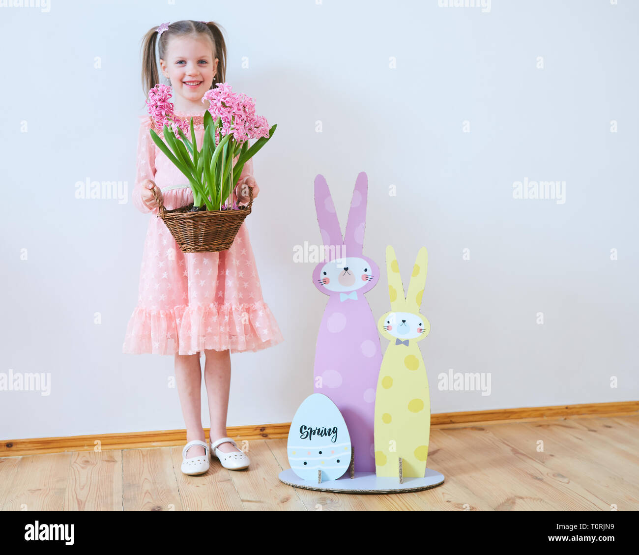Easter 2019 Beautiful little girl in a dress with Easter decorations ...