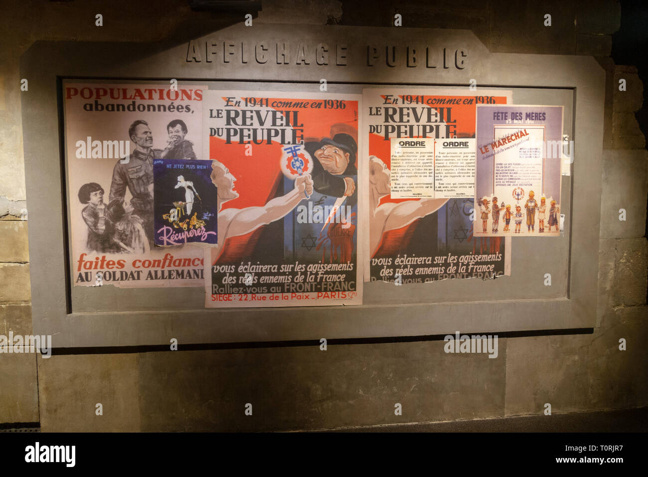 World War Two German propaganda posters urging the French to support the invading troops, Mémorial de Caen (Caen Memorial), Normandy, France. Stock Photo