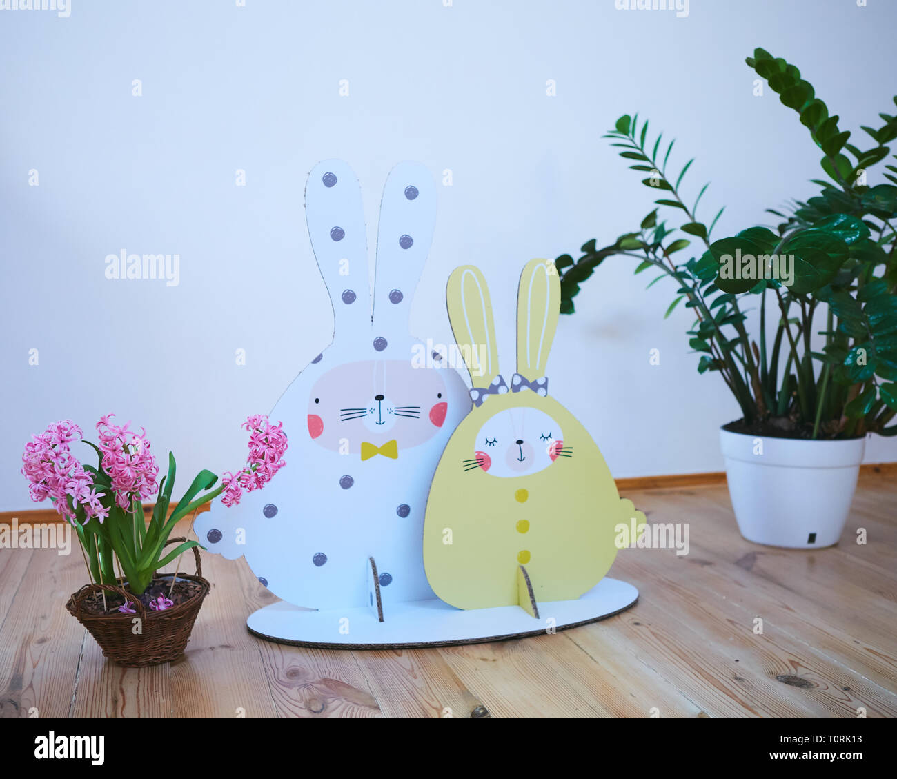 Cardboard Easter bunnies. Easter decor for party. Film effect Stock