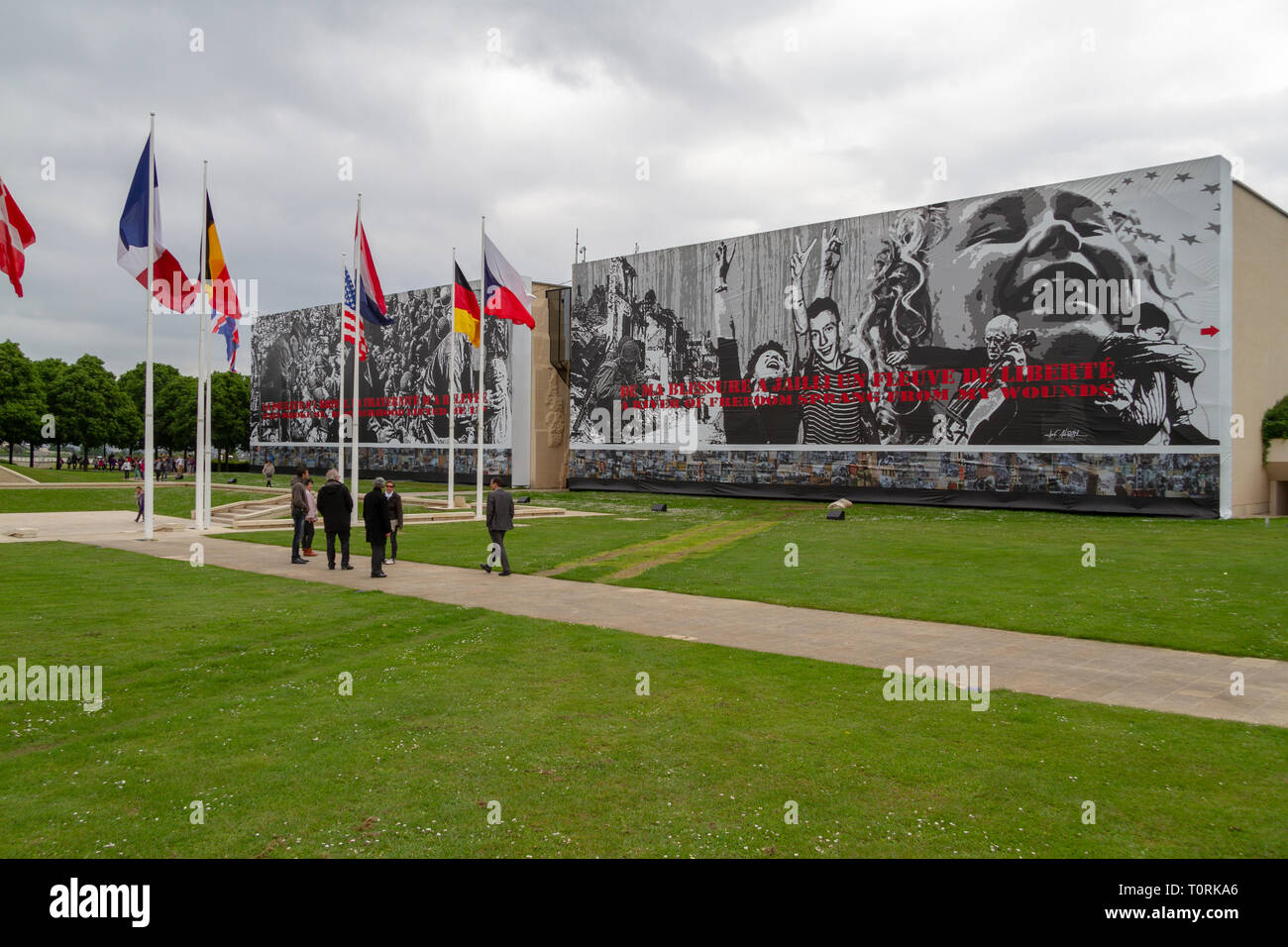 Flags flying outside the Mémorial de Caen (Caen Memorial), Normandy, France. Stock Photo