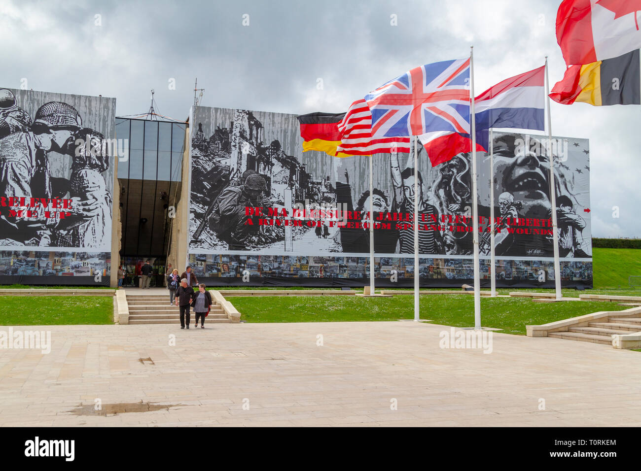 Flags flying outside the Mémorial de Caen (Caen Memorial), Normandy, France. Stock Photo