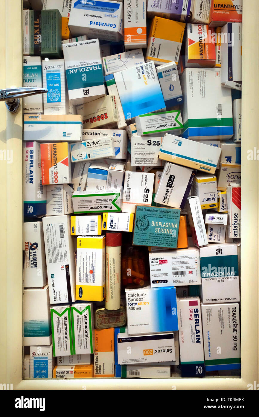 Medicine cabinet filled with medication boxes / drugs for treating mental diseases Stock Photo