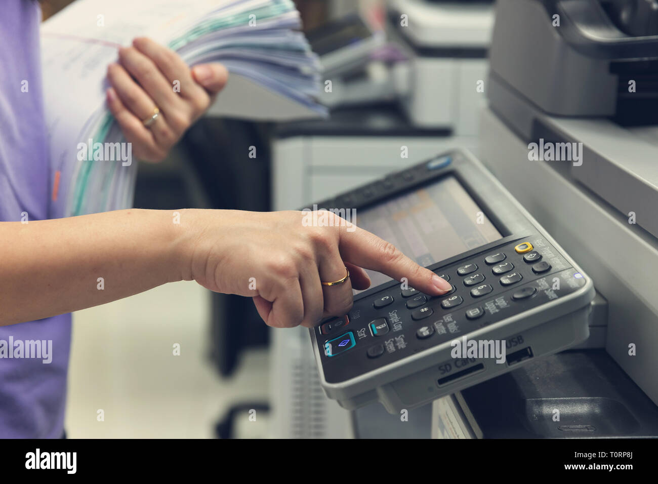 Using copier in busy office hi-res stock photography and images - Alamy