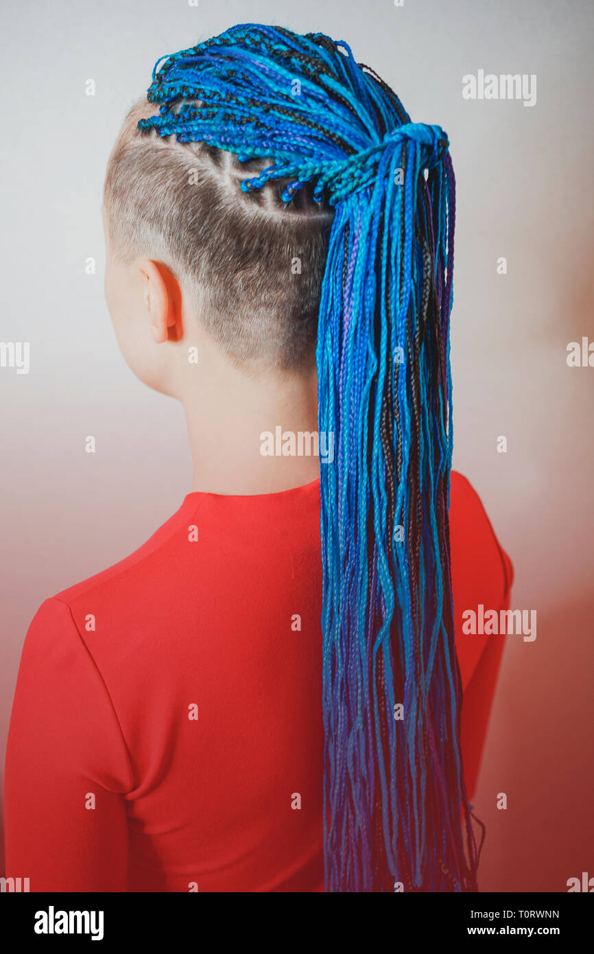 female pigtails, Senegalese braid braid, kanekalon, afrokosy, pigtails on the temple, creative youth hairstyle Stock Photo