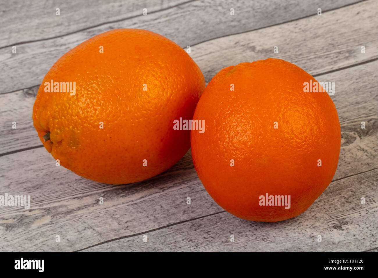 Under Ripe Orange Ripe sweet orange over background Stock Photo - Alamy