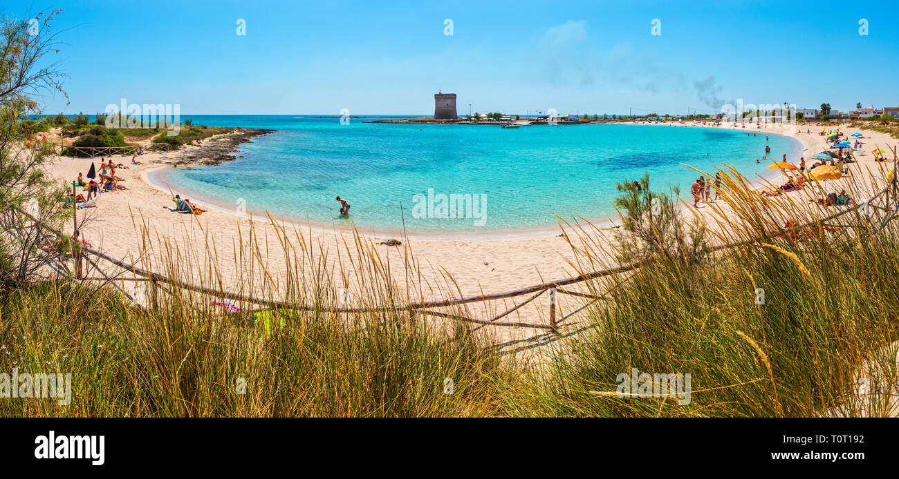 ITALY, PORTO CESAREO - JUNE 08, 2017 : Picturesque Torre Chianca beach and historical fortification tower Torre Chianca (Torre Santo Stefano) on Salen Stock Photo