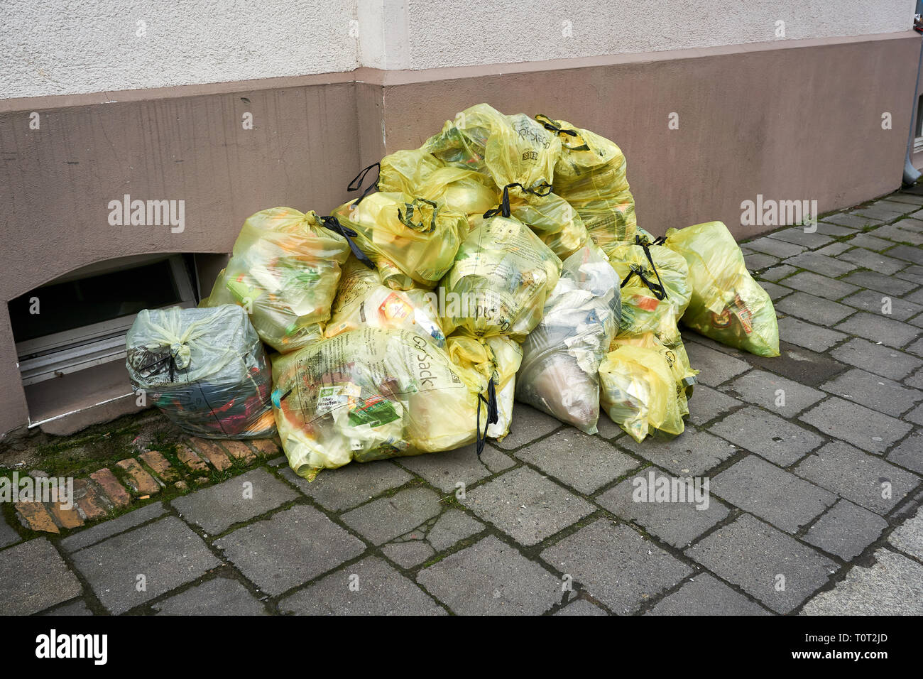 yellow garbage bag with garbage in germany Stock Photo Alamy