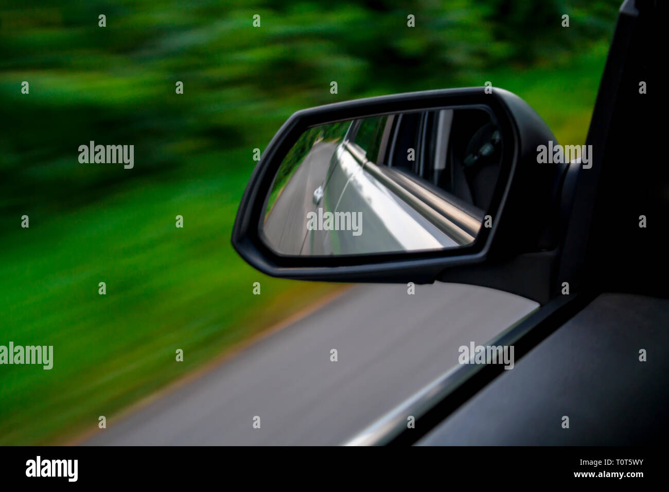 rear view mirror of driving car Stock Photo