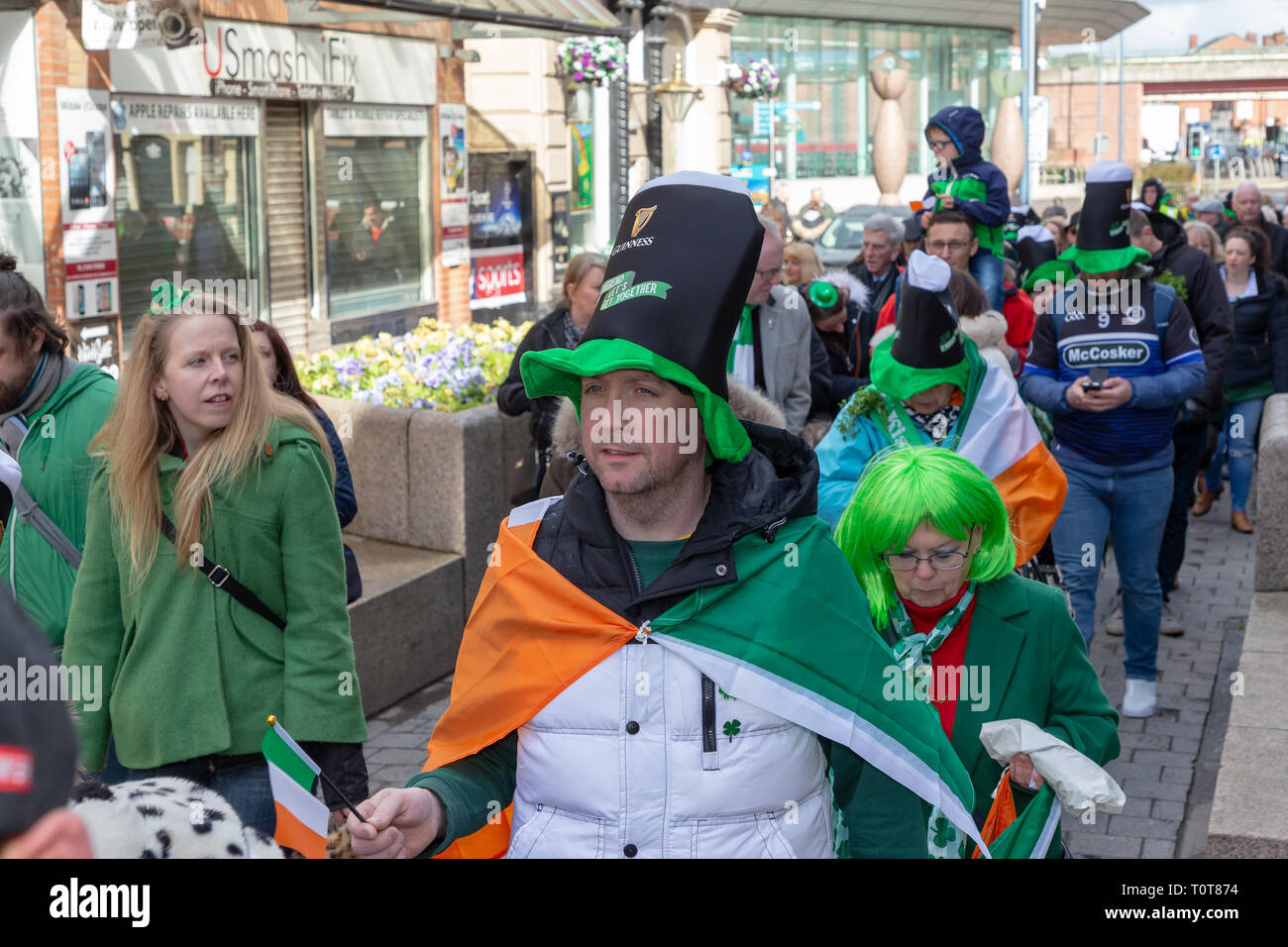 The annual St Patrick’s Day Parade from The Irish Club in Orford Lane to ‘The River of Life’ in Bridge Street. A short service remembered the 25th ann Stock Photo