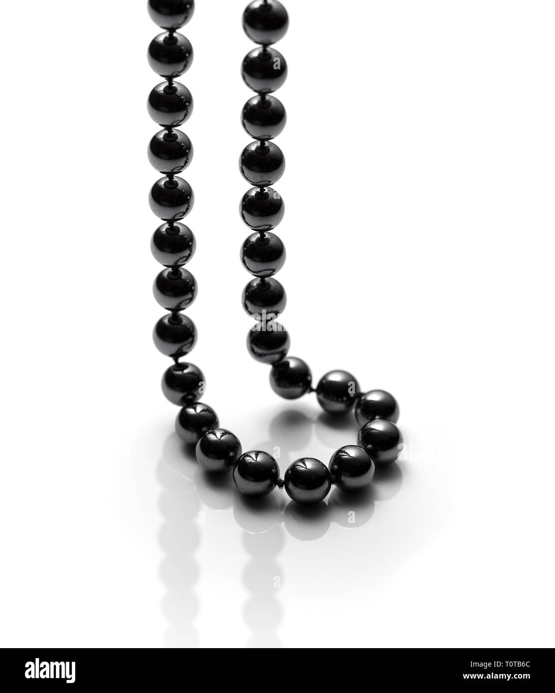 Onyx necklace on white background. Black bead necklace Stock Photo