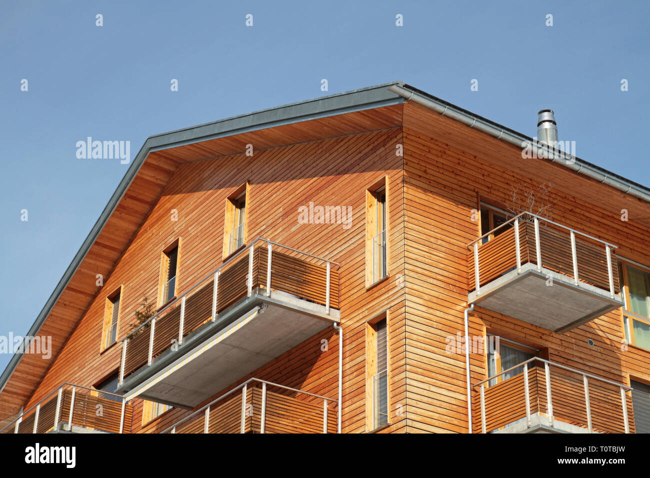 concrete building with wooden facade Stock Photo