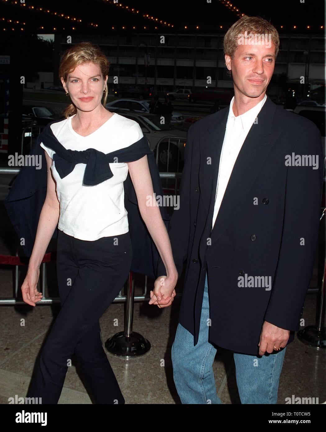 LOS ANGELES, CA. July 21, 1997: Actress Rene Russo & husband Dan Gilroy at the world premiere, in Los Angeles, of 'Air Force One.' Stock Photo