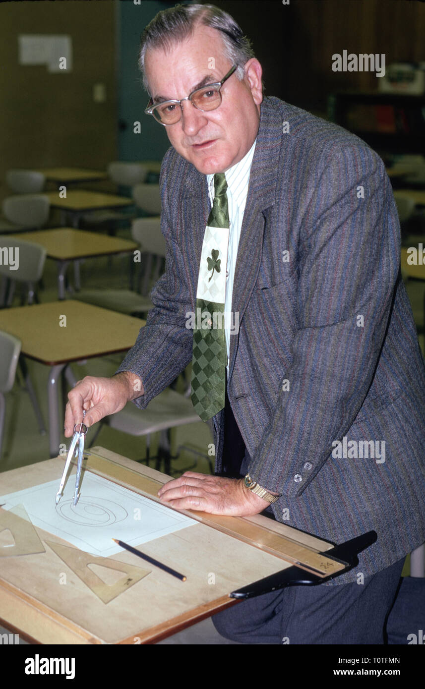 Middle Aged Math Teacher in His Classroom, USA, 1980's Stock Photo