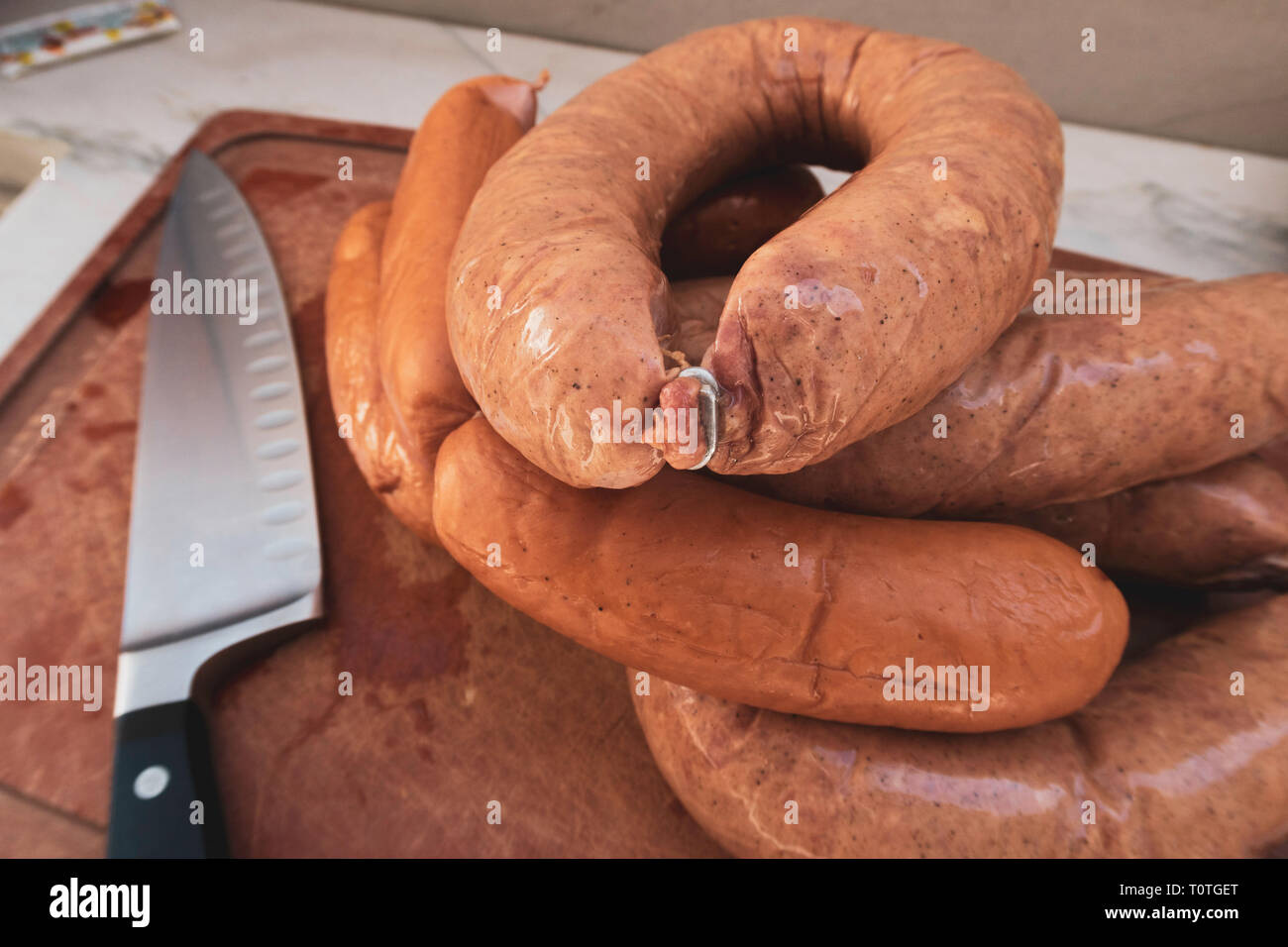 Close-up on Wurst on a Cutting Board in a Residential Kitchen, USA Stock Photo