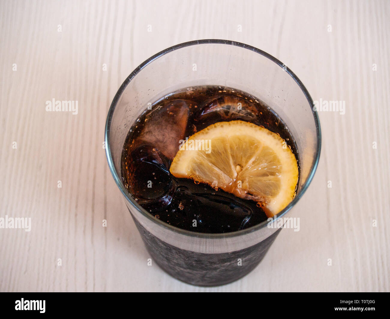 A glass of coke with a slice of lemon Stock Photo