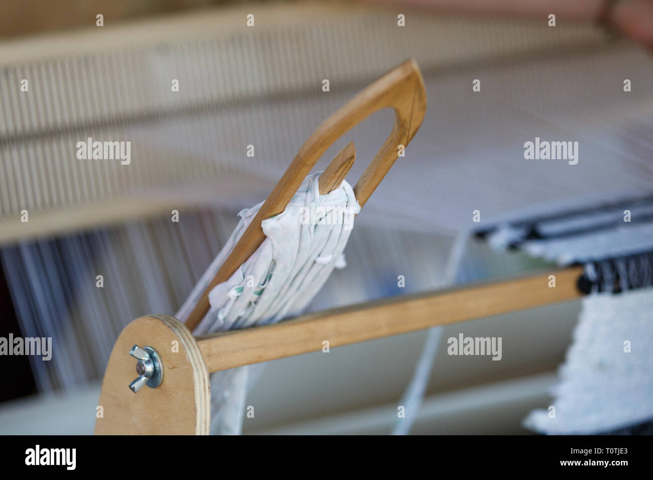 Shuttle that is used in antique loom Stock Photo Alamy