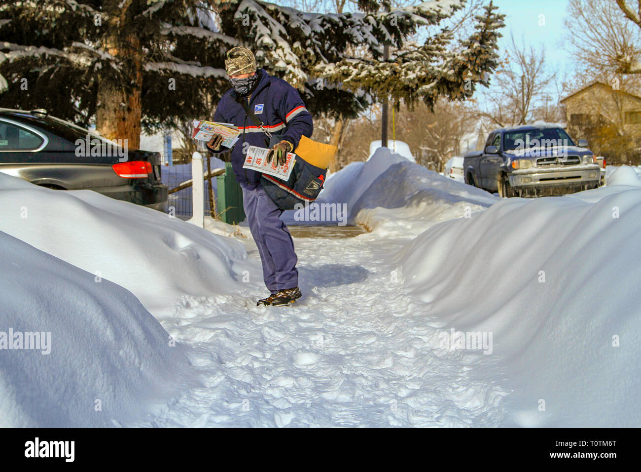 Postman Delivering Snow High Resolution Stock Photography and Images