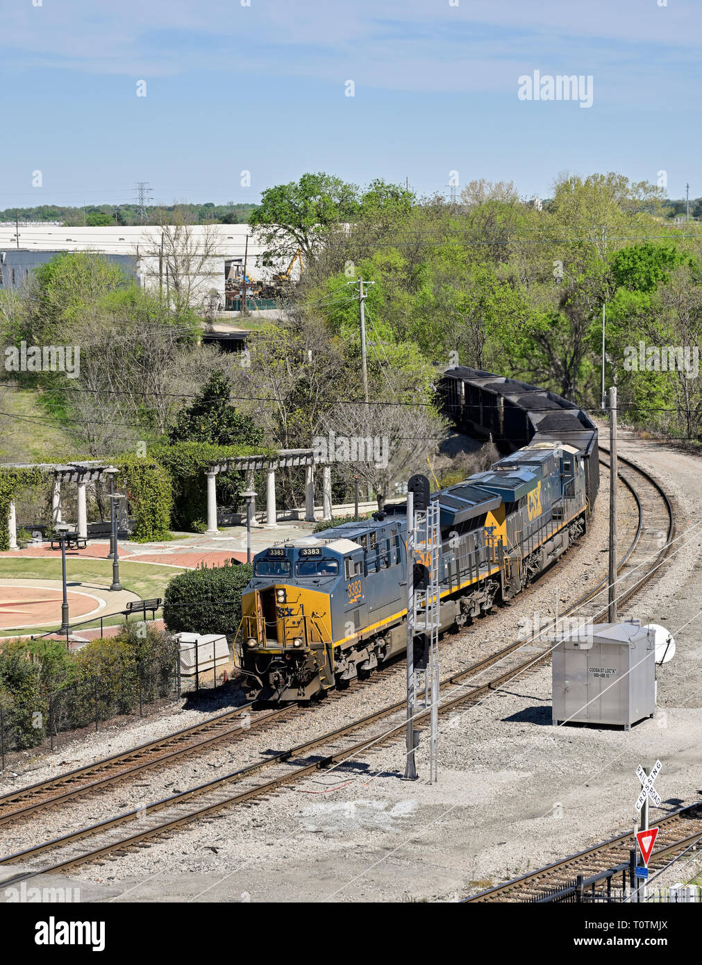 CSX Transportation #3383, an evolution series GE ET44AH diesel electric locomotive, pulling a coal train in Montgomery Alabama, USA. Stock Photo
