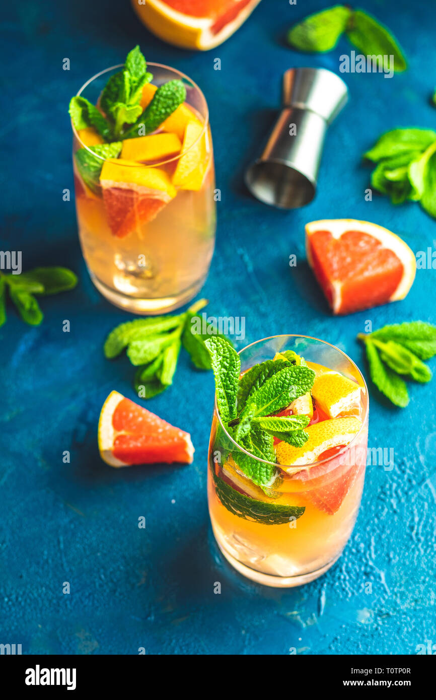 Grapefruit and mint gin tonic cocktail, refreshing drink with ice. Cold