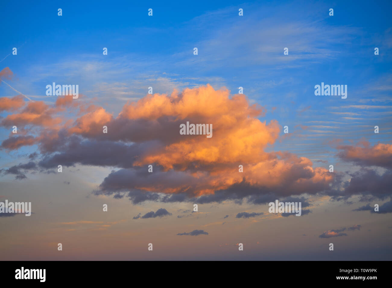 Sunset clouds in orange and blue sky background Stock Photo - Alamy