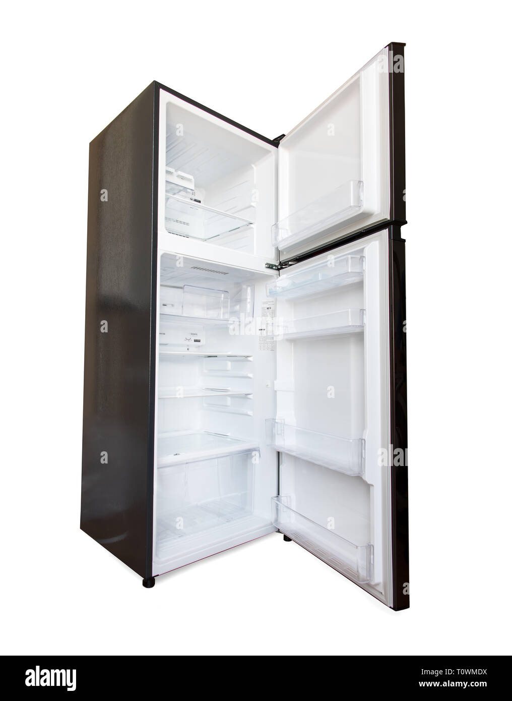 The open new fridge isolated on a white background. Empty refrigerator with open door. Stock Photo