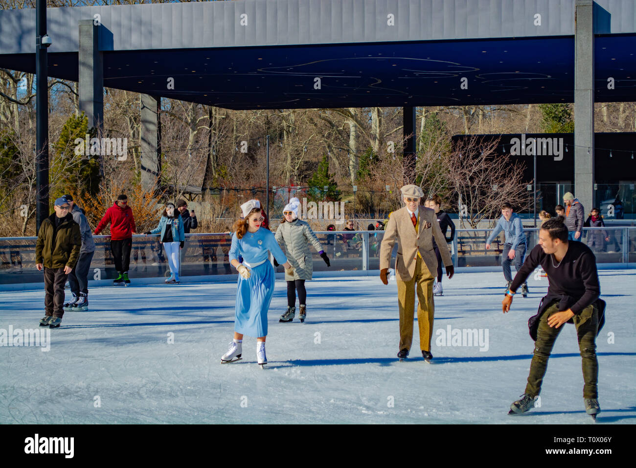 Man and woman dressed in the mid 40's are skating at the prospect park skating rink in New York, Brooklyn 2019 Stock Photo