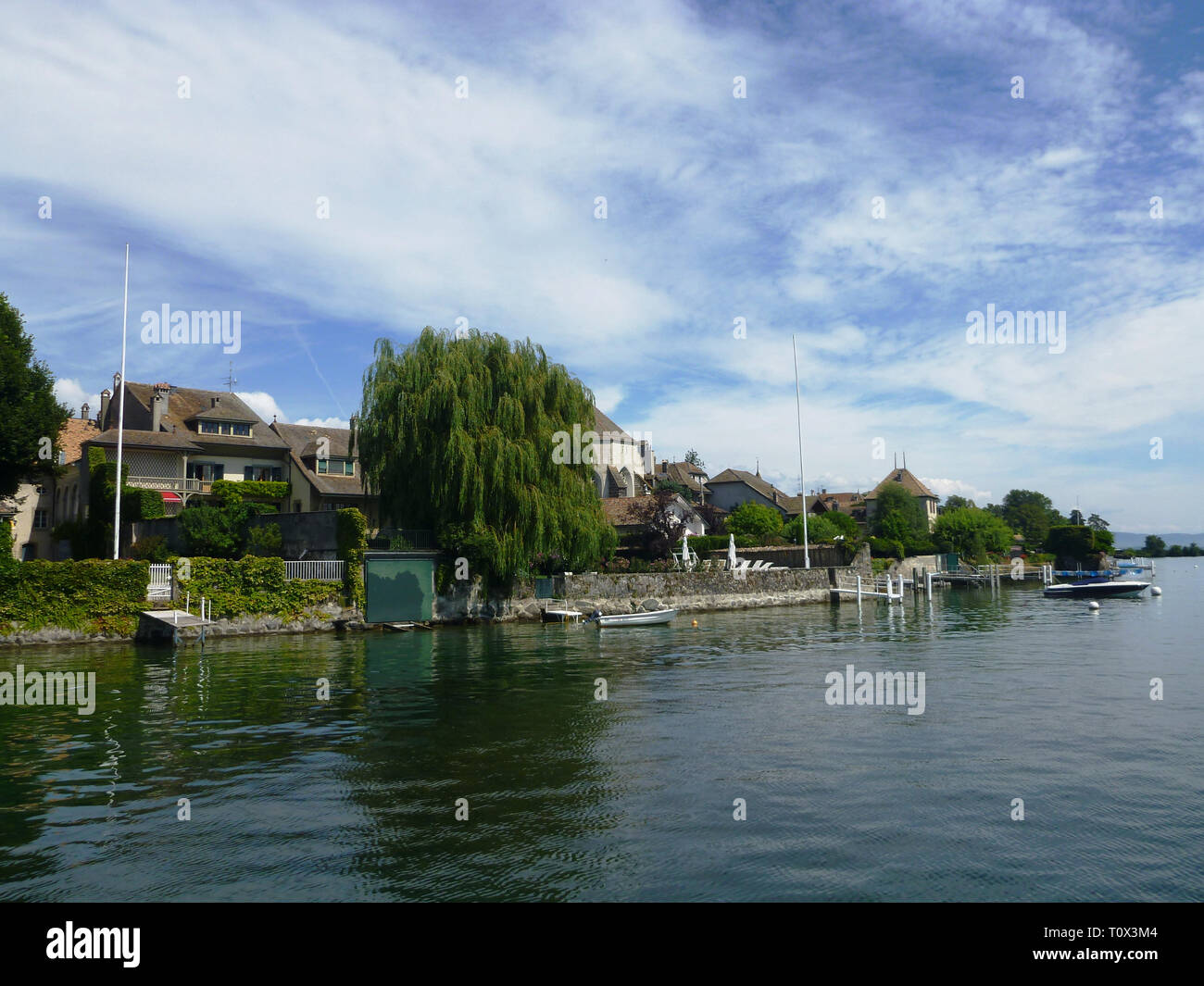 Lake Leman - peaceful view of the shore. Houses and boats Stock Photo