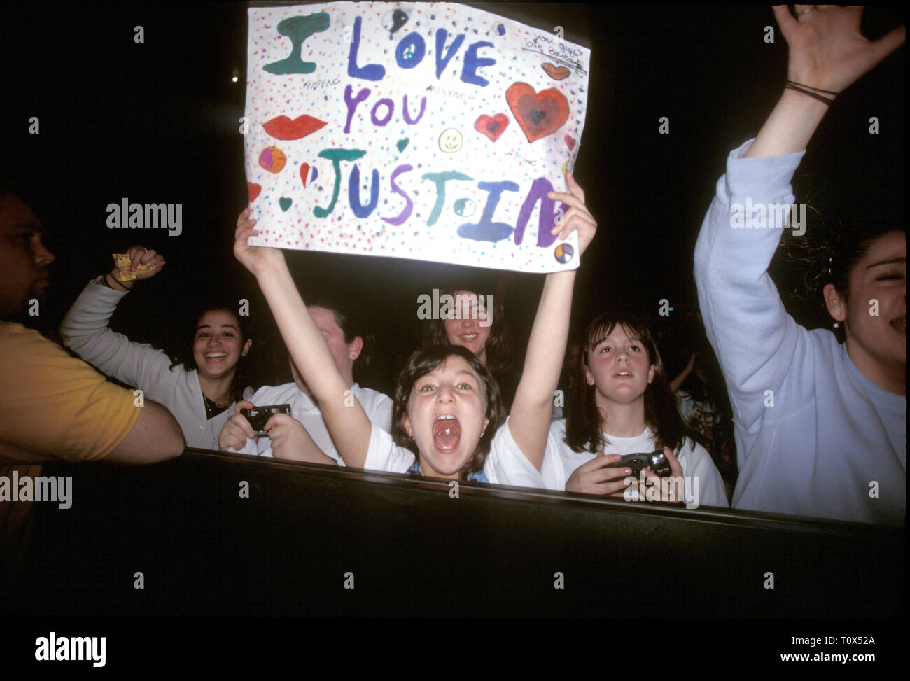 A front row fan shows her interest in Justin Timberlake during a 'live'  concert performance. Stock Photo