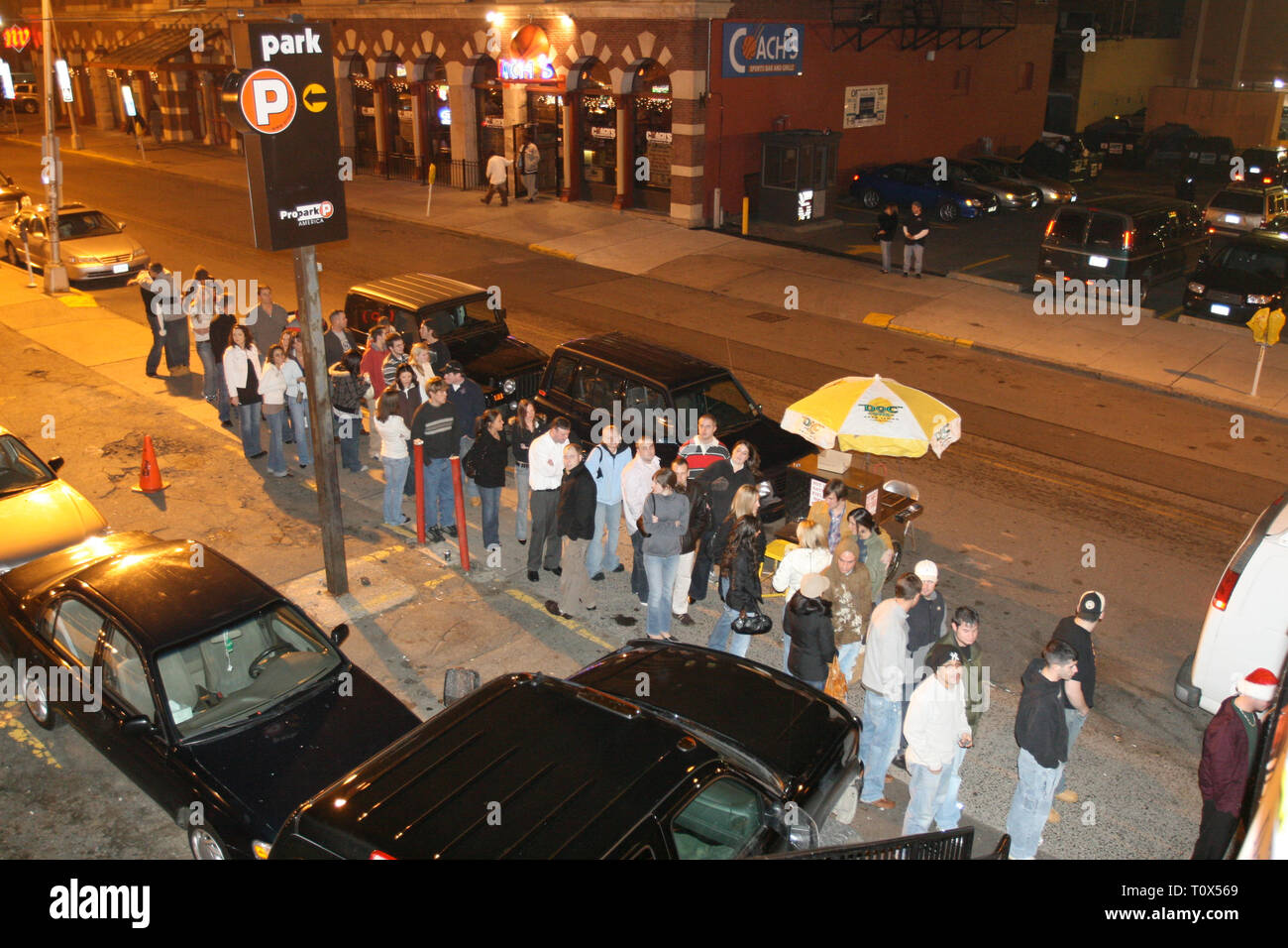 Concert goers are shown lined up on the streets of Hartford waiting to enter a club for a 'live' concert performance. Stock Photo