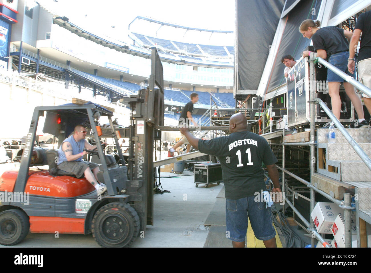 Production workers are shown unloading equipment back stage during an ...