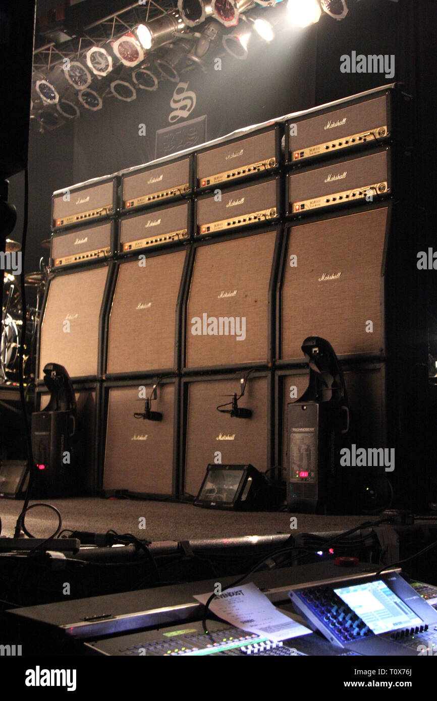 A stack of Marshall Amplifiers are shown on stage getting ready to rock a 'live' concert performance. Stock Photo