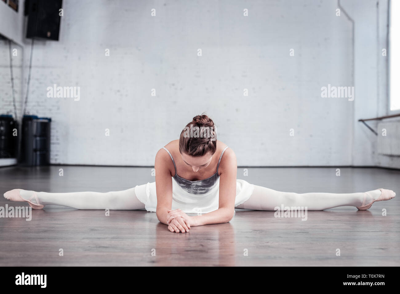 Nice good looking woman practicing her splits Stock Photo