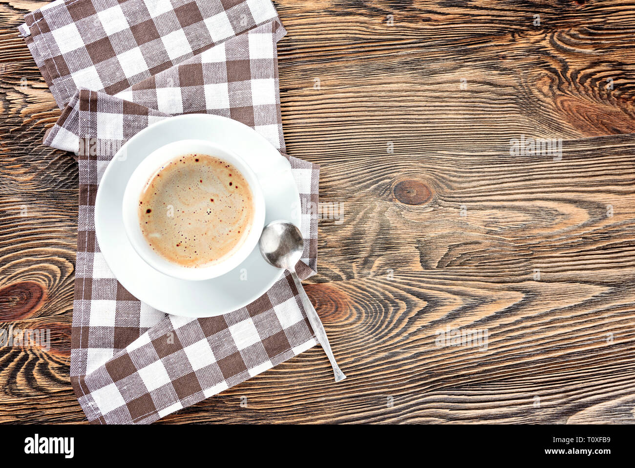 A cup of black hot coffee on a wooden table. Top view. Stock Photo