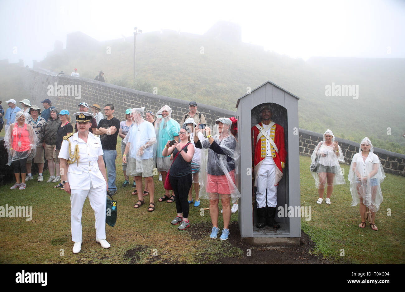 People watch the Prince of Wales during his visit to Brimstone Hill Fortress National Park in St. Kitts and Nevis, a UNESCO World Heritage site during a one day visit to the Caribbean islands. Stock Photo